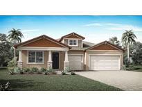Charming single Gathering home featuring a two-car garage, manicured lawn and a welcoming front porch at 2639 Ginseng Ivy St, Apopka, FL 32703
