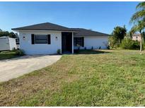 Charming single-story home with a well-maintained lawn and inviting curb appeal at 1750 Mitten Ter, Deltona, FL 32738