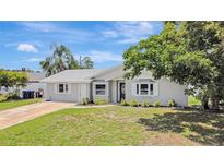 Charming single-story home with a well-manicured lawn and inviting front entrance at 2835 Bongart Rd, Winter Park, FL 32792