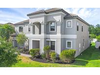Beautiful two-story home featuring a neutral color palette and well-maintained landscaping at 2901 Agostino Ter, Kissimmee, FL 34746
