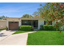 Charming single-story home with manicured lawn and lush landscaping at 3460 Fairway Ln, Orlando, FL 32804