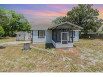 Charming single-story home with a screened-in porch and well-maintained exterior at 6957 Plymouth Sorrento Rd, Apopka, FL 32712