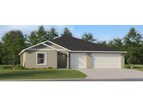 Charming one-story home featuring a two-car garage and a well-maintained lawn at 2030 Forage Dr, Kissimmee, FL 34746