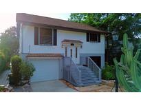 Charming two-story home with a welcoming entryway and a well-maintained front yard at 238 Lake Dr, Orlando, FL 32835