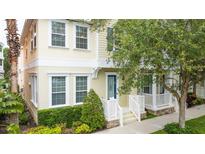 Charming two-story home with a lovely porch and well-maintained landscaping at 338 Roberts Family Ln, Winter Springs, FL 32708