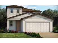 Charming two-story home featuring a two-car garage and beautifully landscaped front yard at 3904 Giorgio Dr, Winter Haven, FL 33884