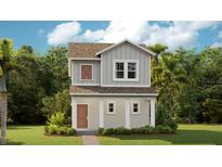 Charming two-story home featuring a covered front porch, neutral siding, and lush landscaping at 2171 Stake Out Way, Apopka, FL 32703
