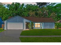 Charming single-story home featuring a well-maintained lawn, inviting curb appeal, and a cozy, Gathering-friendly atmosphere at 3150 Rider Pl, Orlando, FL 32817