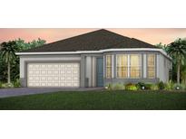 Charming home exterior with a neutral color palette, a two-car garage, and bay windows at 5512 Settlingstone Ln, St Cloud, FL 34771