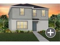 Charming two-story home with a well-manicured lawn and inviting entryway at 7262 Summer Ivy Aly, Orlando, FL 32829