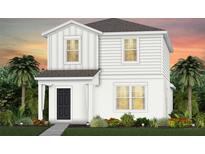 Charming two-story home with a black front door, white siding, lush landscaping and a welcoming curb appeal at 2241 Southbury Dr, Kissimmee, FL 34744