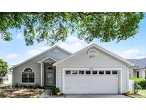 Charming single-Gathering home featuring a two-car garage, manicured lawn, and beautiful curb appeal at 3055 Dellcrest Pl, Lake Mary, FL 32746