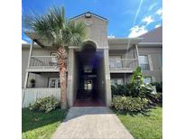 Condo exterior showcasing lush landscaping, and balcony at 315 Wymore Rd # 104, Altamonte Springs, FL 32714