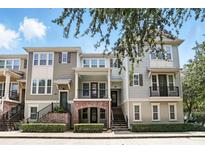 Charming townhome with inviting porch and well-maintained landscaping for great curb appeal at 439 Windmill Palm Cir, Altamonte Springs, FL 32701