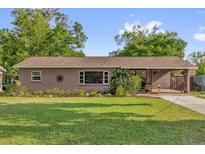 Charming single-story home with a well-maintained lawn and inviting curb appeal at 512 Dixson St, Orange City, FL 32763