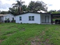 Charming single-story home with a well-maintained lawn and classic architecture at 5416 Vance Ave, Orlando, FL 32810
