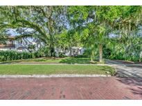 Charming home with mature trees and well-manicured lawn at 171 Cortland Ave, Winter Park, FL 32789