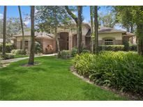 Charming single-Gathering home with lush landscaping and mature trees, offering great curb appeal at 4823 Shoreline Cir, Sanford, FL 32771