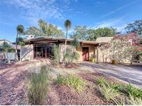 Charming single-story home featuring a uniquely landscaped front yard and a cozy front patio at 1840 Laurel Rd, Winter Park, FL 32789
