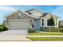 Charming single-Gathering home featuring a stone facade, a two-car garage, and beautifully landscaped front yard at 2500 Raghav Trail Cir, Tavares, FL 32778