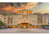 Stunning building exterior with a fountain and meticulously maintained landscaping creates an inviting curb appeal at 500 Mirasol Cir # 203, Celebration, FL 34747