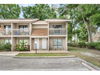 Inviting townhome with a charming exterior, featuring a cozy balcony and well-maintained landscaping at 752 Howland Ln # 114, Altamonte Springs, FL 32701