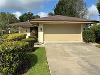 Charming home featuring a large two-car garage and well-manicured landscaping at 116 Oakmont Ln, New Smyrna Beach, FL 32168