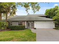 Charming single-story home featuring a manicured lawn and attached two-car garage, perfect for suburban living at 359 Westwind Ct, Lake Mary, FL 32746