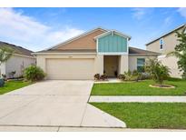Charming single-story home features a well-maintained lawn and a two-car garage at 4444 Quartz Ct, Lakeland, FL 33811