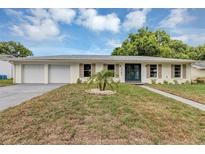 Charming single-story home featuring a well-manicured lawn and a welcoming double-door entryway at 822 Glen Arden Way, Altamonte Springs, FL 32701