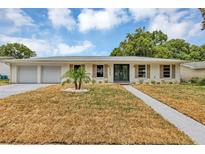 Charming single-story home with a well-manicured front yard and double-door entryway for a classic look at 822 Glen Arden Way, Altamonte Springs, FL 32701
