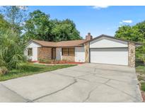 Charming single-story home with a stone accent exterior and a well-manicured lawn at 111 Main St, Windermere, FL 34786