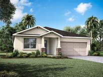 Charming single-story home with a two-car garage, complemented by lush landscaping and a blue sky at 13232 Pergola Ave, Orlando, FL 32832