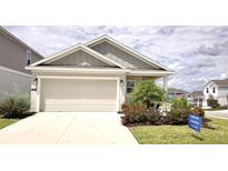 Charming single-Gathering home with a two-car garage, well-maintained landscaping, and welcoming curb appeal at 2002 Punch Bowl Ave, Davenport, FL 33837