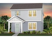 Charming two-story home with a welcoming front porch and lush landscaping at 2237 Southbury Dr, Kissimmee, FL 34744