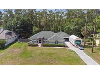 Charming single story home with arched entryway and large canopy to the side at 14612 Bray Rd, Orlando, FL 32832