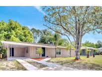 Charming single-story home featuring a neatly landscaped front yard and cozy covered entryway at 1533 Fort Smith Blvd, Deltona, FL 32725