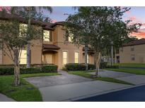 Inviting two-story townhome with lush landscaping and private entrances at 412 Verona Ave, Davenport, FL 33897