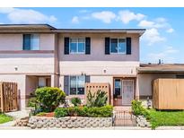 Charming two-story townhome with a well-maintained front yard and garden at 1312 Azalea Way, Winter Garden, FL 34787