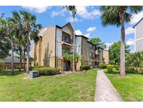 Well-maintained condo complex with manicured landscaping and vibrant green spaces at 1908 Lake Atriums Cir # 3, Orlando, FL 32839