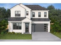 Two story home with a modern design, featuring white stucco, dark trim, and a gray door and garage door at 2508 Depauw Ave, Orlando, FL 32804