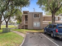 Charming condo featuring a private entrance, well-maintained landscaping, and convenient parking at 5083 Eaglesmere Dr # A12, Orlando, FL 32819