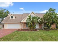 Charming single-Gathering home with a well-manicured lawn, brick accents, and a spacious driveway at 1135 Thunder Trl, Maitland, FL 32751