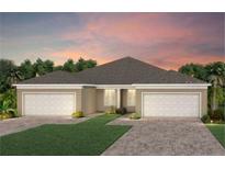 Inviting single-story home with a two-car garage and well-manicured landscaping, perfect for suburban living at 1811 Spring Shower Cir, Kissimmee, FL 34744