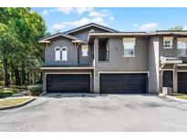 Two-story townhouse with a two-car garage and neutral exterior paint at 209 Villa Di Este Ter # 205, Lake Mary, FL 32746