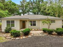 Charming single-story home with well-manicured landscaping and inviting entrance at 2193 County Road 204, Oxford, FL 34484