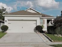 Charming single-Gathering home featuring a two-car garage and well-maintained landscaping at 3202 Timber Hawk Cir, Ocoee, FL 34761