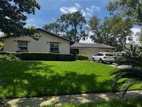 Charming single-story home boasts a well-manicured lawn and a convenient two-car garage at 404 Broadview Ave, Altamonte Springs, FL 32701