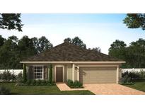 Inviting one-story home with a neutral color scheme, attached garage, and a well-maintained lawn at 6056 Vision Rd, St Cloud, FL 34771