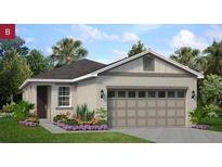 Charming single-story home with a two-car garage, well-maintained lawn and colorful flower beds at 9112 Wildlight Trl, Wildwood, FL 34785
